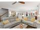 Spacious living room with hardwood floors, comfortable seating, and an open layout to the kitchen at 2721 Rustic Brick Rd, Raleigh, NC 27603