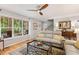 Comfortable living room featuring large windows, hardwood floors, and stylish furnishings at 2721 Rustic Brick Rd, Raleigh, NC 27603
