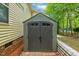 Durable backyard storage shed with double doors, providing ample space for tools and equipment, with brick foundation at 2721 Rustic Brick Rd, Raleigh, NC 27603