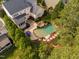 Aerial view of a home's backyard pool, mature landscaping, and inviting outdoor spaces at 3004 Montville Valley Ct, Cary, NC 27519