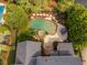 Backyard oasis with a custom pool, landscaping, and outdoor seating area, captured from above at 3004 Montville Valley Ct, Cary, NC 27519