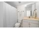 Bathroom features a shower with curtain, toilet, and single vanity with a framed mirror at 3004 Montville Valley Ct, Cary, NC 27519
