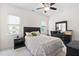 Bedroom featuring natural light, ceiling fan, and black furniture set on neutral carpet at 3004 Montville Valley Ct, Cary, NC 27519