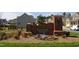 Community entrance with brick sign, landscaping, and established neighborhood at 3004 Montville Valley Ct, Cary, NC 27519