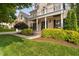 Beautiful home featuring a stone facade, welcoming porch, and manicured landscaping at 3004 Montville Valley Ct, Cary, NC 27519