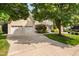Spacious home with a three-car garage and a manicured front yard at 3004 Montville Valley Ct, Cary, NC 27519