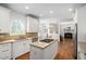 Bright open kitchen with stainless steel appliances, granite countertops, and hardwood floors at 3004 Montville Valley Ct, Cary, NC 27519