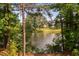 Lake view surrounded by lush trees and landscape at 3004 Montville Valley Ct, Cary, NC 27519