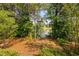 Serene lake view surrounded by lush greenery, offering a peaceful outdoor escape at 3004 Montville Valley Ct, Cary, NC 27519