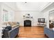 Bright living room boasts a fireplace, hardwood floors, and a vaulted ceiling at 3004 Montville Valley Ct, Cary, NC 27519