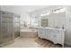 Luxurious main bathroom with a corner tub, walk-in shower, and a double vanity at 3004 Montville Valley Ct, Cary, NC 27519