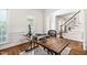 Spacious home office featuring hardwood floors, wainscoting, and ample natural light at 3004 Montville Valley Ct, Cary, NC 27519