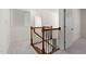 Staircase with wooden railing and carpet, leading to upstairs bedrooms at 3004 Montville Valley Ct, Cary, NC 27519