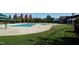 Community pool is surrounded by lush green lawn and covered seating areas at 3004 Montville Valley Ct, Cary, NC 27519