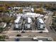 Aerial view showcases contemporary townhome community with modern architecture, landscaping, and street parking at 3007 Corbell Rd, Durham, NC 27701