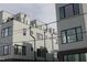 Stylish townhomes with modern design, featuring clean lines, multiple windows, and private balconies at 3007 Corbell Rd, Durham, NC 27701