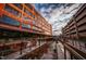 Urban landscape featuring brick buildings, waterways, metal railings and architectural reflections at 3007 Corbell Rd, Durham, NC 27701