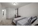 A bright bedroom featuring neutral walls, a simple desk and comfortable accents at 3015 Cypress Lagoon Ct, Durham, NC 27703