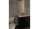 Bathroom with tile floors, vanity with dark cabinets, and toilet at 305 Theys Mill, Fuquay Varina, NC 27526