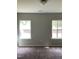 Bright bedroom with two windows providing natural light and neutral paint at 305 Theys Mill, Fuquay Varina, NC 27526