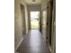 Inviting entryway featuring sleek wood-look floors and a view of the home's facade through an open door at 305 Theys Mill, Fuquay Varina, NC 27526