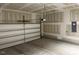 Spacious garage with unfinished walls offering ample storage and parking at 305 Theys Mill, Fuquay Varina, NC 27526
