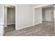 Spacious living room featuring freshly painted walls, gray vinyl floors and natural light at 308 Caswell St, Burlington, NC 27217