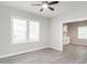 Living room with windows for natural light, and a view into the kitchen area at 308 Caswell St, Burlington, NC 27217