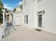 The back of the house features a light-colored deck, white siding, and a green lawn at 3303 Glen Currin Dr, Raleigh, NC 27612