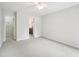 Spacious bedroom with neutral carpet and ceiling fan at 3303 Glen Currin Dr, Raleigh, NC 27612