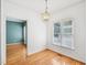 Bright and airy dining room with hardwood floors and modern chandelier at 3303 Glen Currin Dr, Raleigh, NC 27612