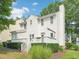 The back of the house features a light-colored deck, white siding, and a green lawn at 3303 Glen Currin Dr, Raleigh, NC 27612