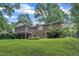 Spacious brick home with a screened-in porch and a large, grassy backyard at 3304 Redbud Ln, Raleigh, NC 27607