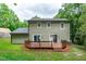 The backyard features a wooden deck with a grass area, and it borders the tree line at 3330 Nantuckett Ave, Durham, NC 27703