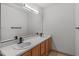 Bathroom featuring a double sink vanity with neutral counter tops and flooring at 3330 Nantuckett Ave, Durham, NC 27703