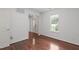 Bedroom with hardwood floors, white walls, and lots of natural light from the window at 3330 Nantuckett Ave, Durham, NC 27703