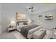 Staged bedroom with neutral decor, ceiling fan, and a comfortable king-size bed at 3330 Nantuckett Ave, Durham, NC 27703