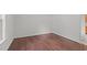 Empty bedroom with hardwood floors and lots of natural light from the window at 3330 Nantuckett Ave, Durham, NC 27703