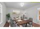 Elegantly staged dining room with modern decor and ample seating for entertaining at 3330 Nantuckett Ave, Durham, NC 27703