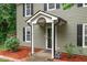 Close-up of the home's inviting entrance, highlighting the covered porch and landscaping at 3330 Nantuckett Ave, Durham, NC 27703