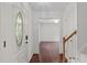 Bright foyer featuring hardwood floors, a decorative front door, and access to other rooms at 3330 Nantuckett Ave, Durham, NC 27703