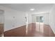 Bright living room with hardwood floors, natural light, and access to additional living spaces at 3330 Nantuckett Ave, Durham, NC 27703