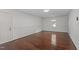 Spacious living room with hardwood floors, neutral paint, and a bright window at 3330 Nantuckett Ave, Durham, NC 27703