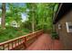 Spacious back deck overlooks lush greenery and beautiful treeline with plenty of space to entertain at 3416 Ocotea St, Raleigh, NC 27607