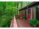 Inviting back deck featuring fresh landscaping and peaceful, natural surroundings at 3416 Ocotea St, Raleigh, NC 27607