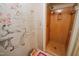 Pink vintage shower next to pink toilet and bidet with floral wallpaper at 3416 Ocotea St, Raleigh, NC 27607