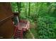 Aerial view of a red deck overlooking a forest of lush green trees at 3416 Ocotea St, Raleigh, NC 27607