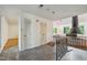A tiled foyer with two closets and a view into a living room area with a fireplace at 3416 Ocotea St, Raleigh, NC 27607