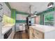 Bright kitchen with white cabinets, stainless steel appliances, and a center island at 3416 Ocotea St, Raleigh, NC 27607
