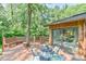 Spacious back deck with an outdoor dining set, perfect for entertaining guests or enjoying casual meals outdoors at 36 Birnamwood Dr, Chapel Hill, NC 27516